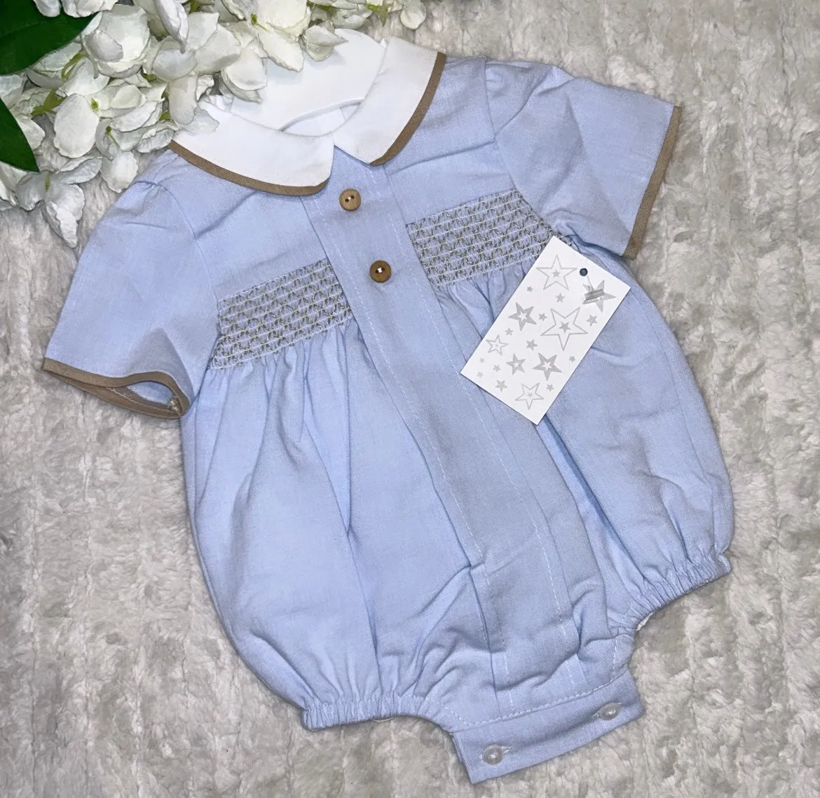 Blue boys romper with beige